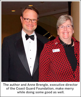 The author and Anne Brengle, executive director of the Coast Guard Foundation, make merry  while doing some good as well.