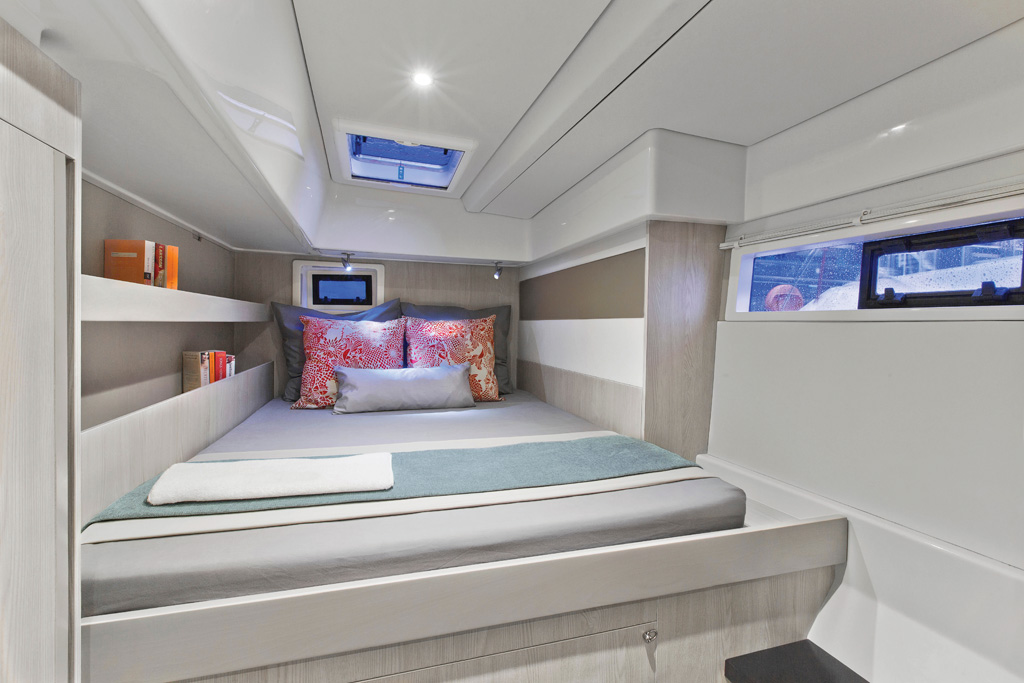 The aft stateroom has fiddled shelves, windows for ventilation, and plenty of space for a couple. - click to enlarge