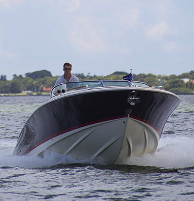 Dan Harding driving a Chris-Craft. Photo by John V Turner Dan Harding driving a Chris-Craft. Photo by John V Turner