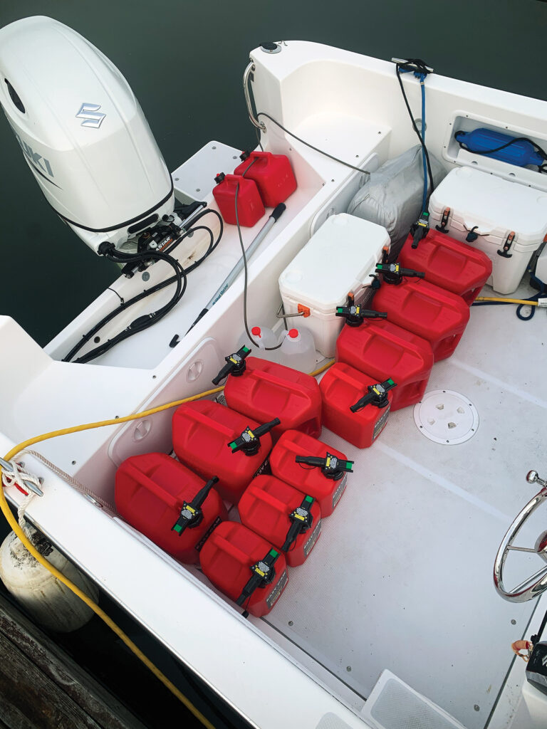 a group of red gas containers in a boat