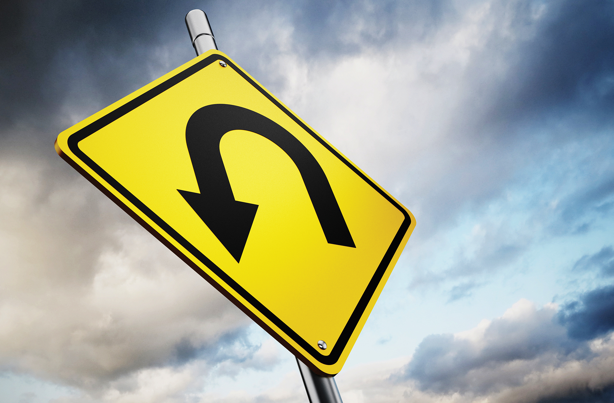 Stock photo of a u-turn sign