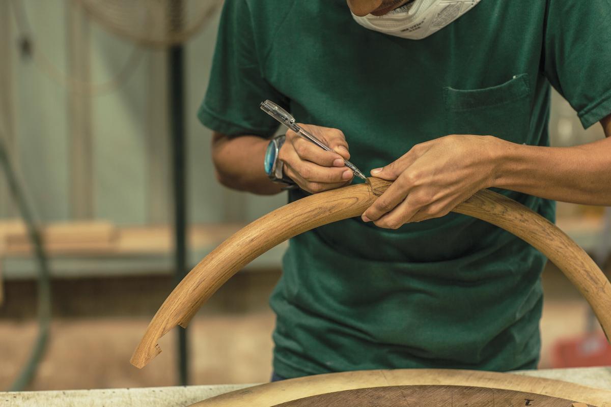 Hands of a craftsman at the Grand Banks facility in Malaysia