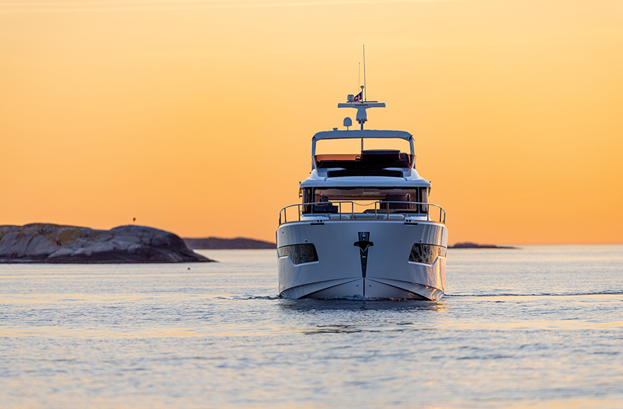 Yacht in lagoon at sunset