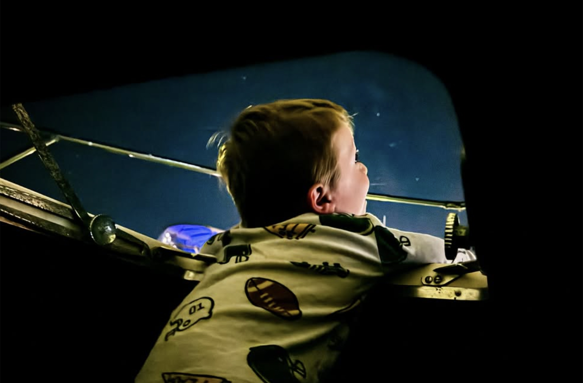 Young boy stargazing