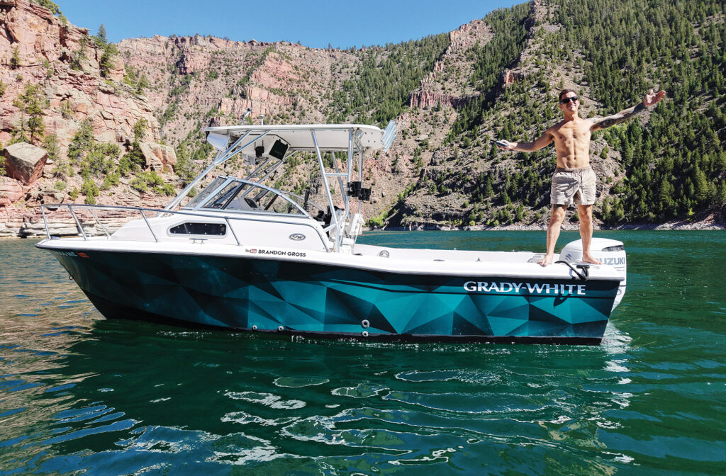 shirtless white man on a boat