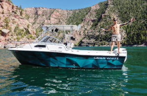 shirtless white man on a boat
