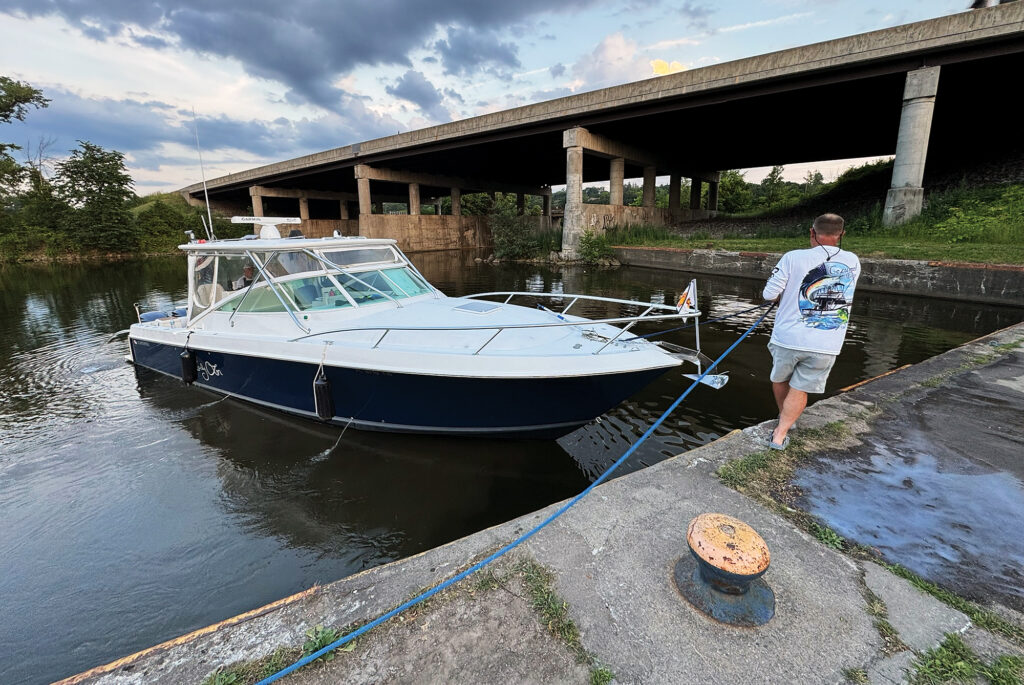 A man warping a boat