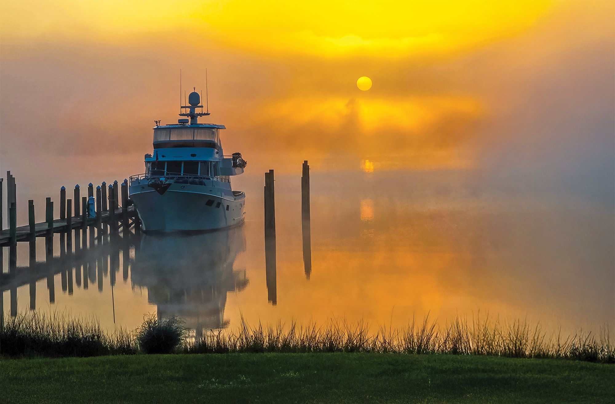 Boat at dock with dreamy sunrise