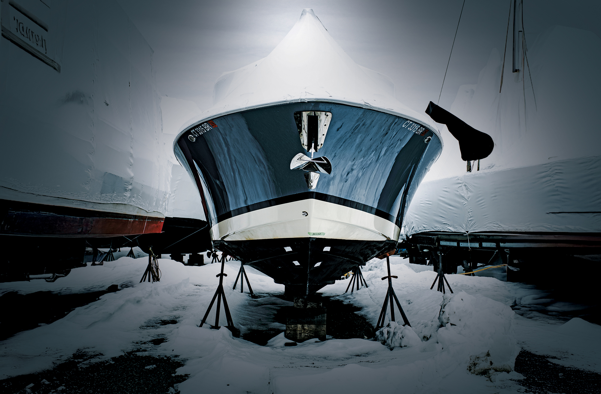 Boat on the hard covered in snow.