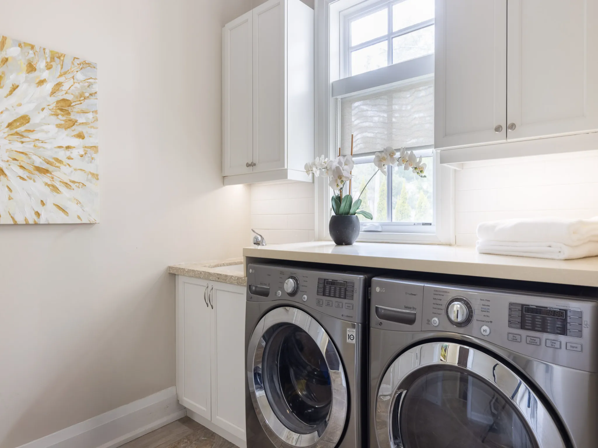 laundry room with silver washer and dryer