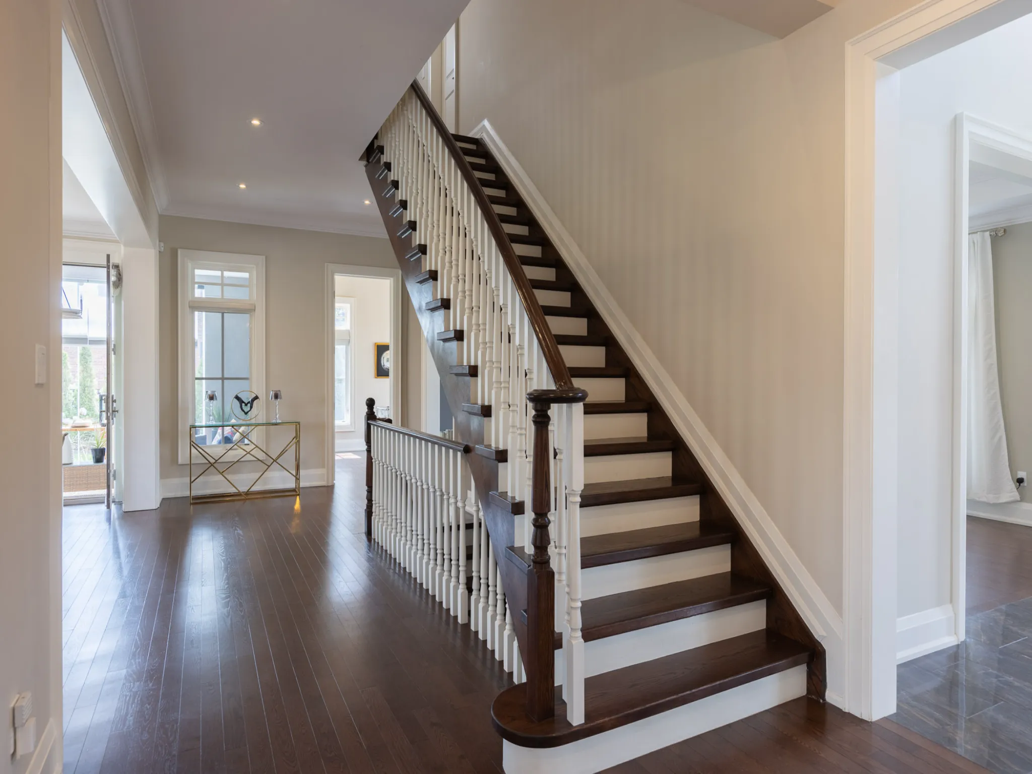staircase with white risers and dark wood grain treads