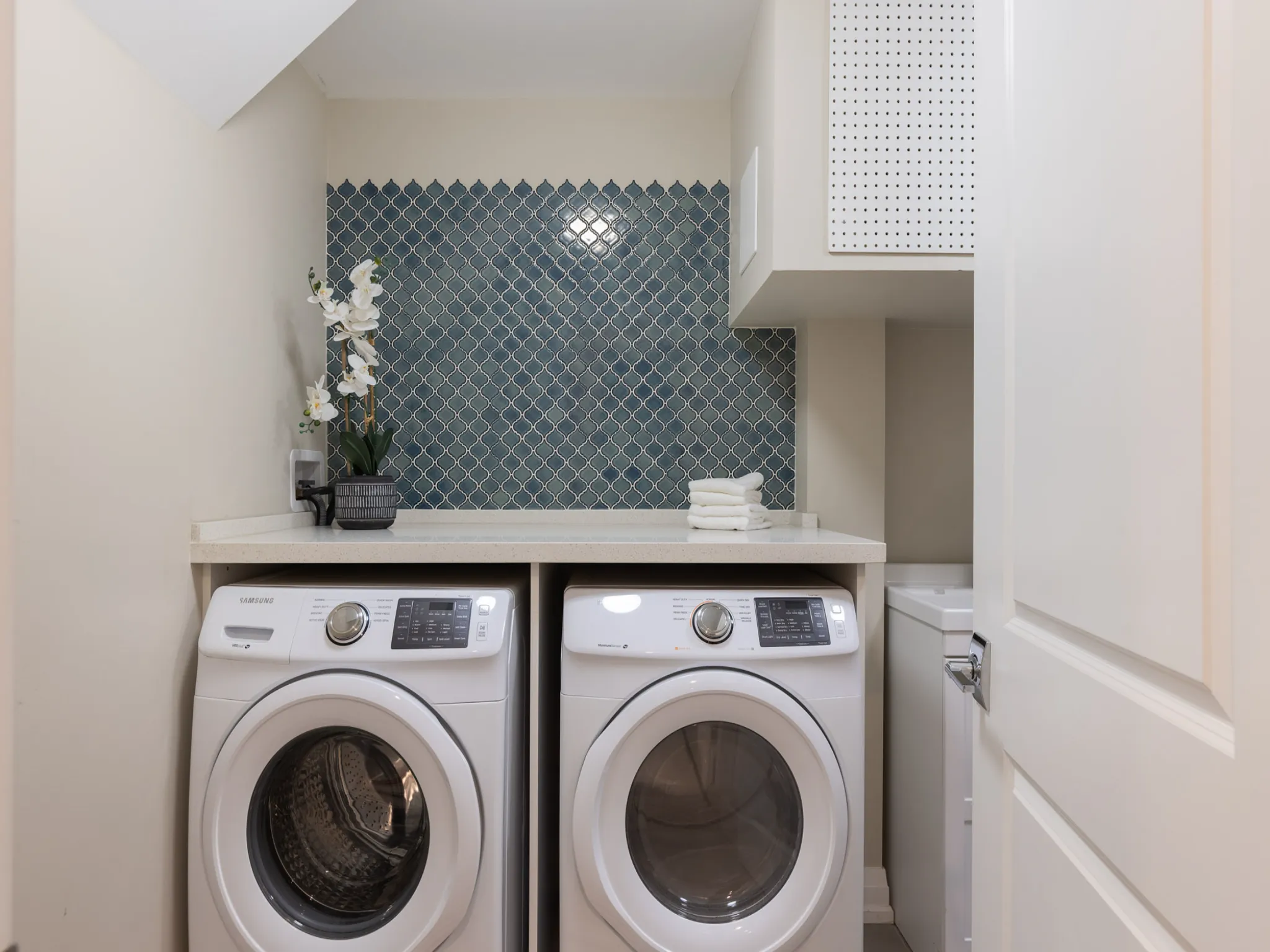 laundry room with a white washer and dryer