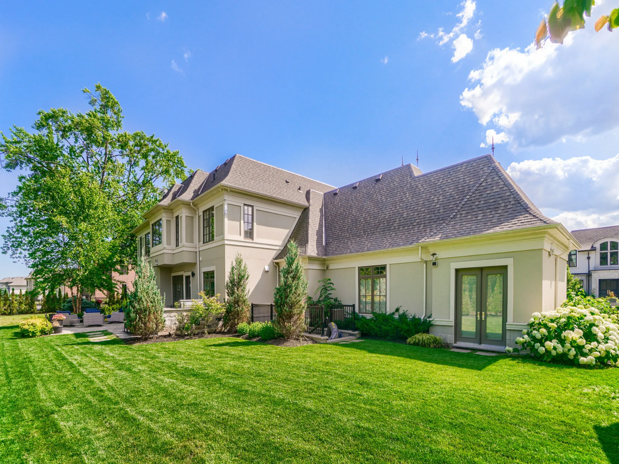 exterior of the home - freshly cut grass and luxurious house