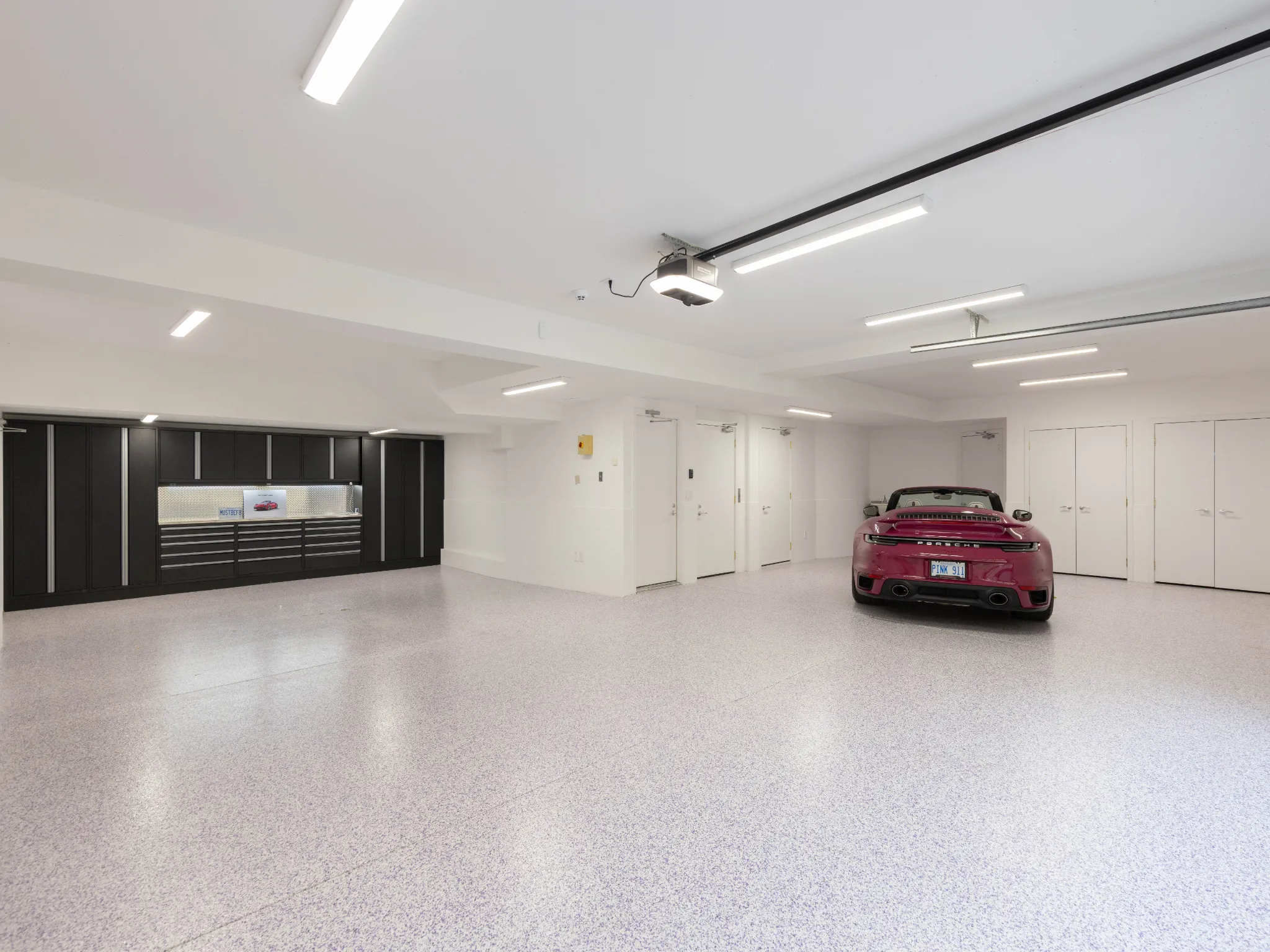 expansive luxury garage with parking for MANY cars