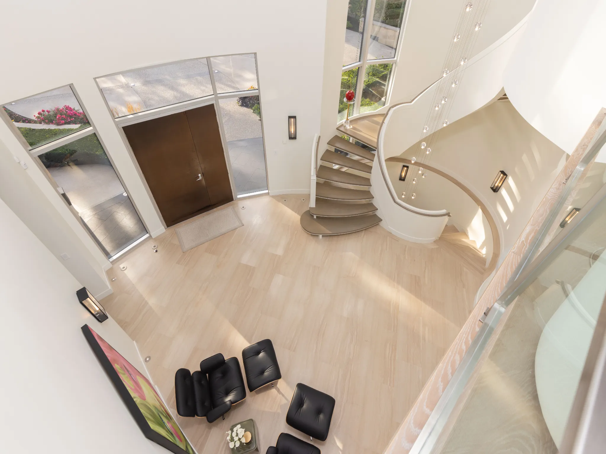 views from the upstairs hallway, looking down at the foyer