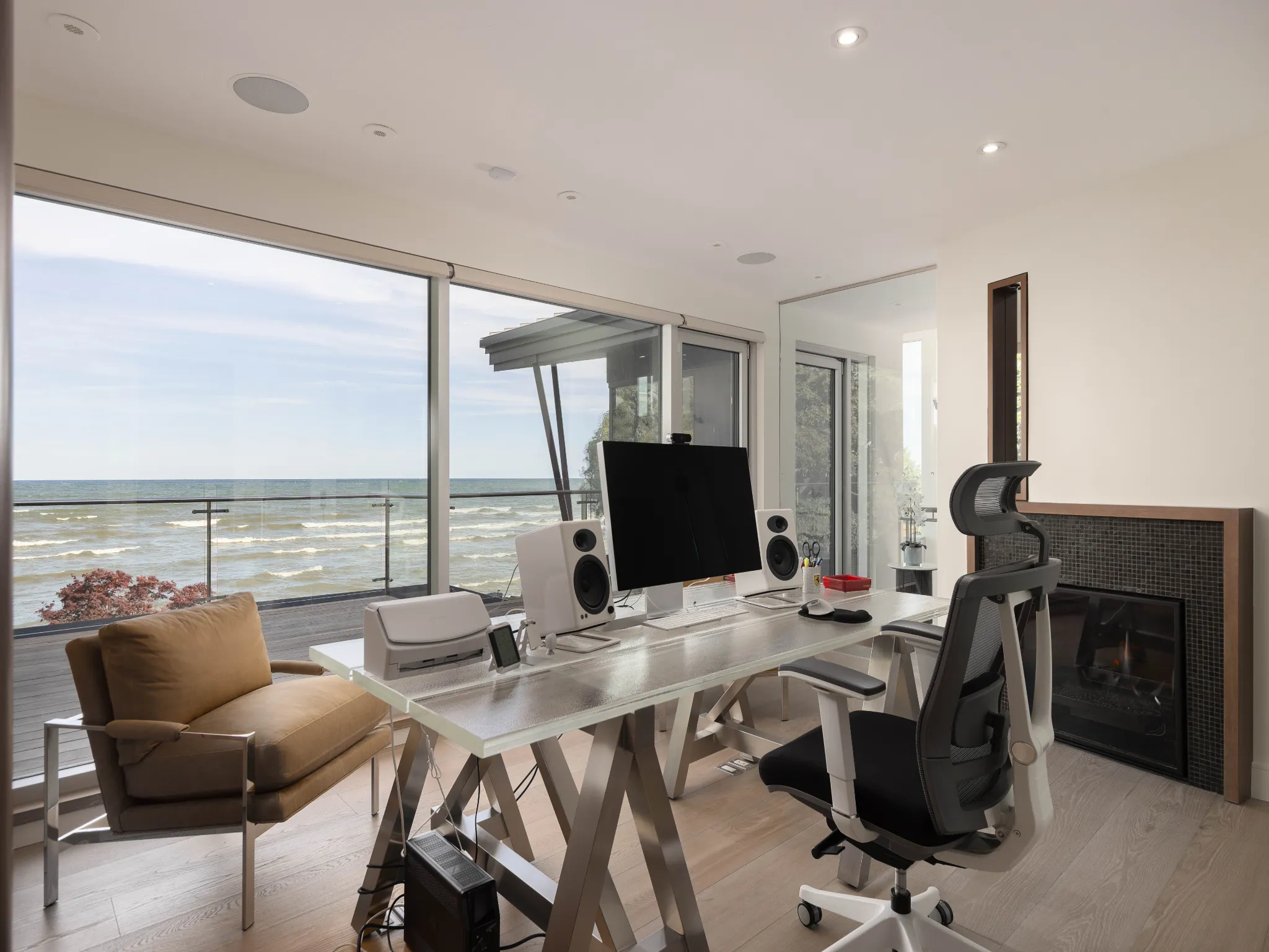 office with large glass windows, with views of the lake