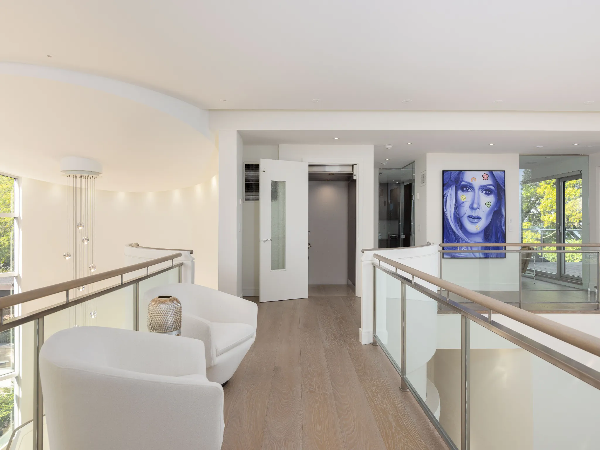 the catwalk upstairs with stylish art and lots of lighting