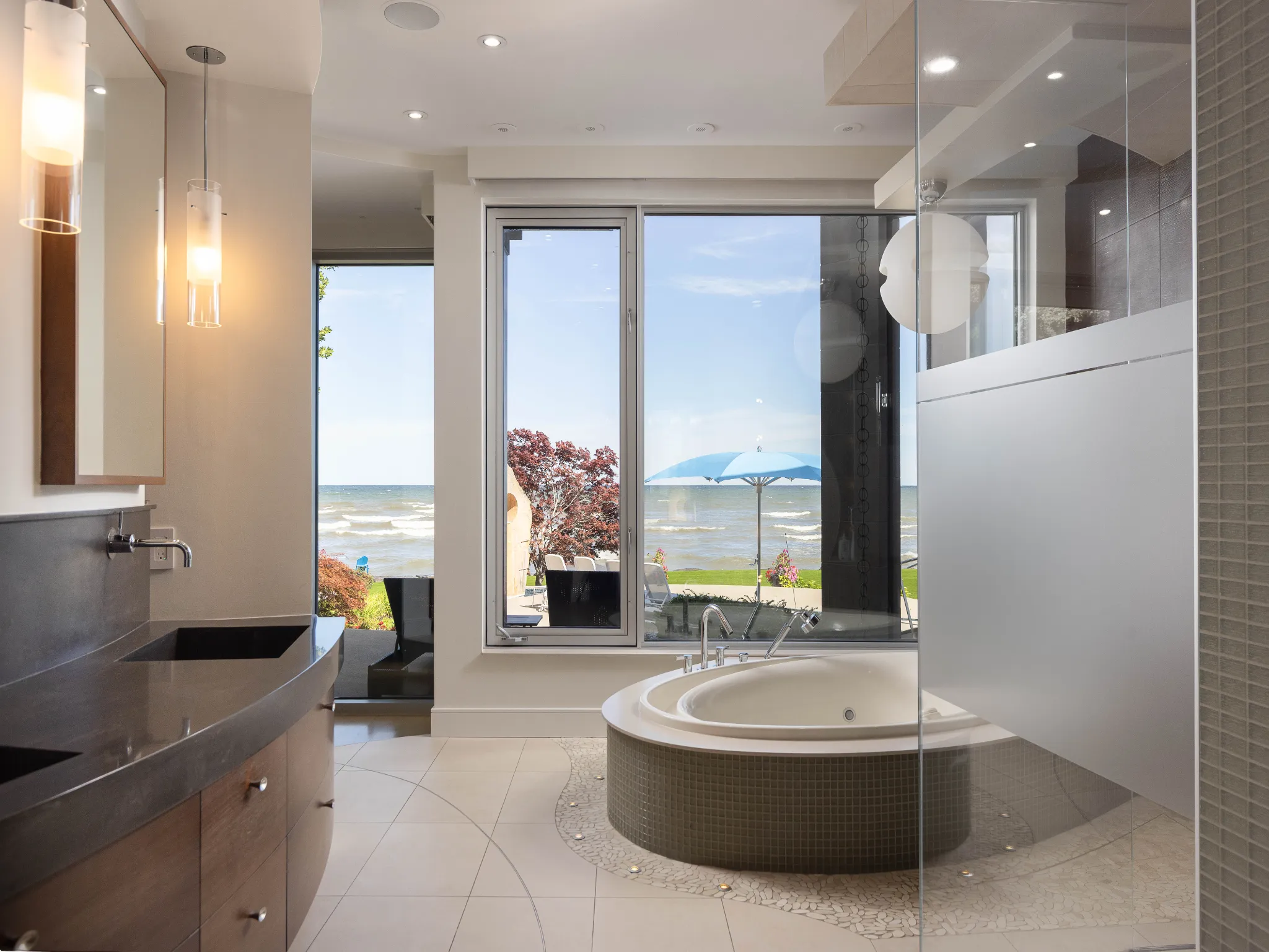 principle bathroom with large soaker tub overlooking the lake