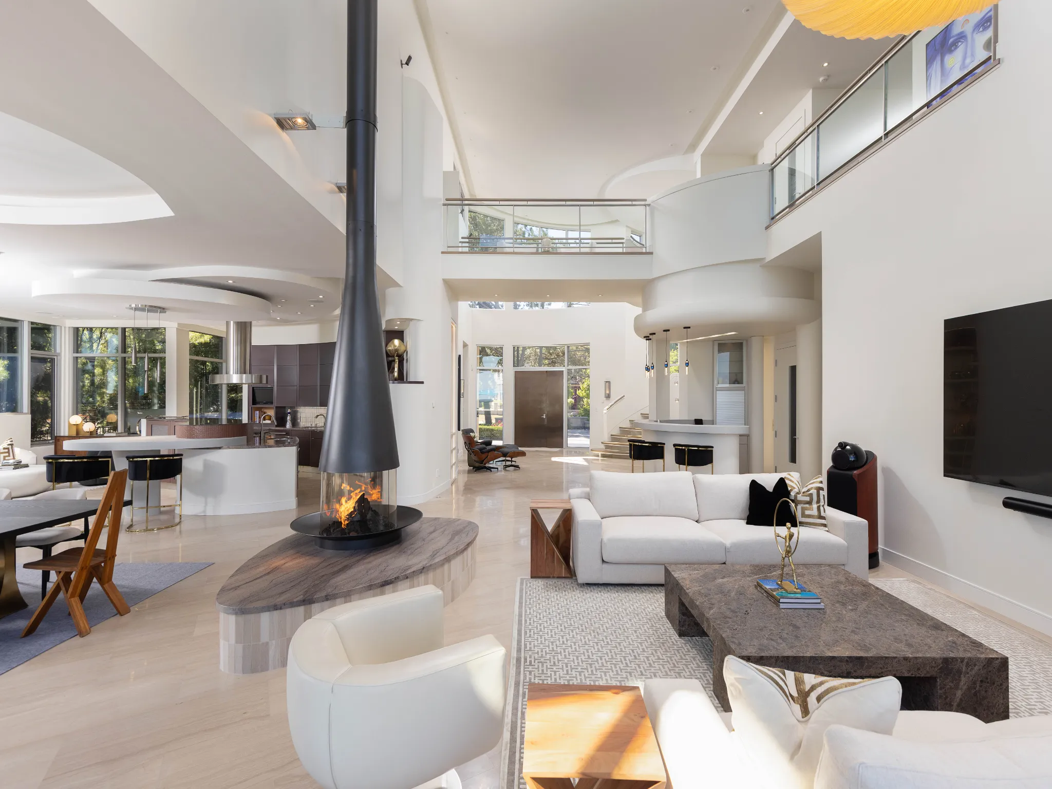 living room photo with modern and sculptural fireplace