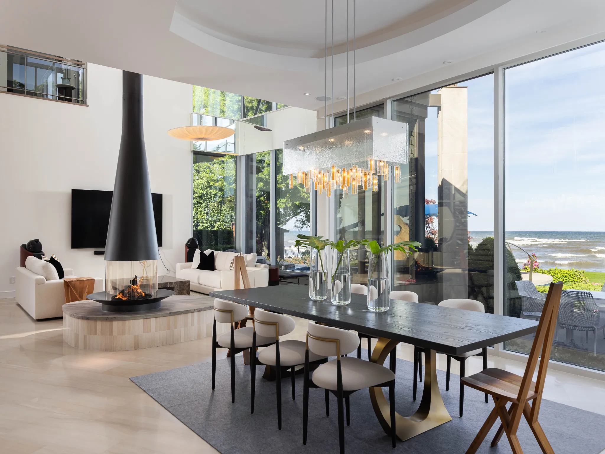 dining room with luxurious chandelier and views overlooking the lake