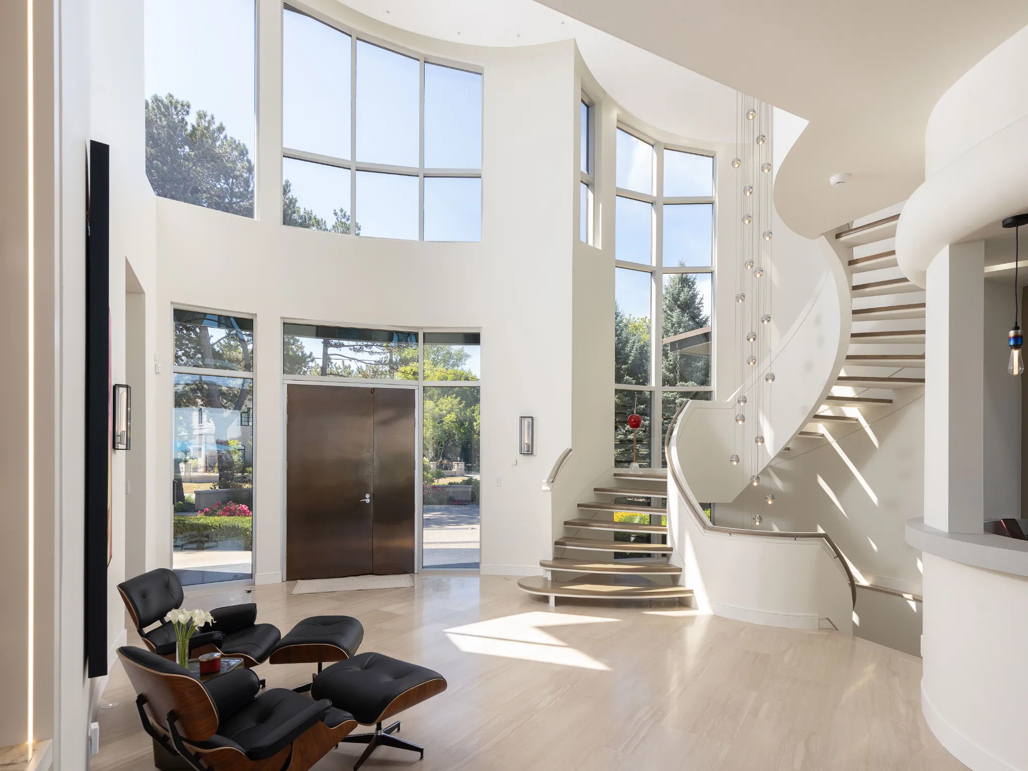 front entrance is a grand foyer with large winding staircase