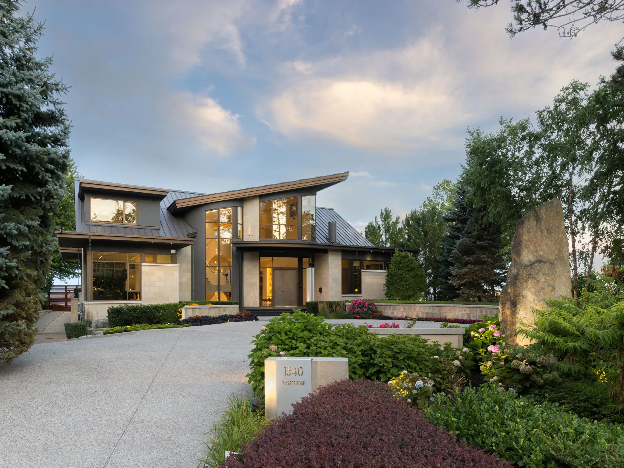 exterior of a modern home with large driveway