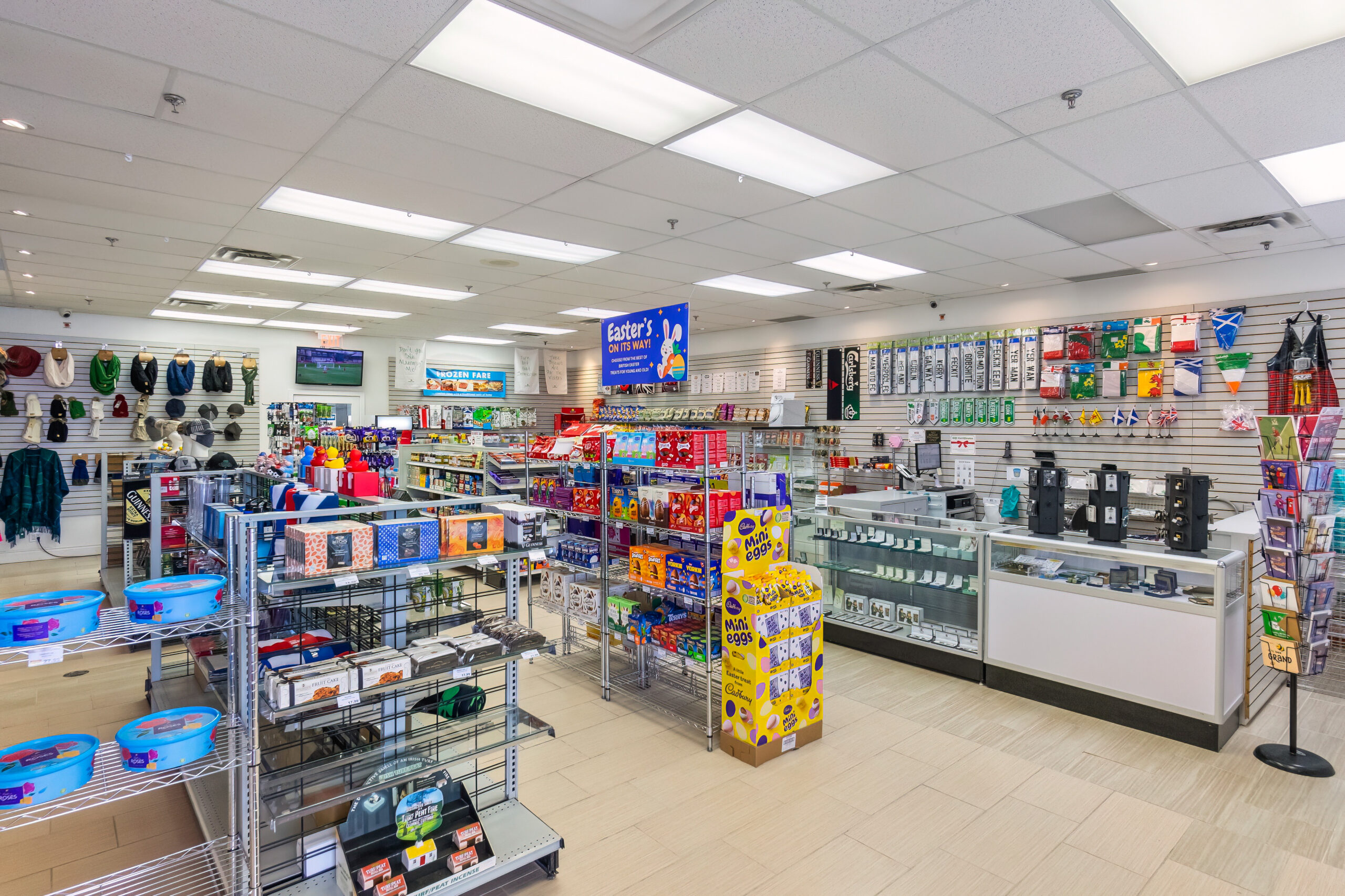 Bright retail store interior with shelves of merchandise and display cases
