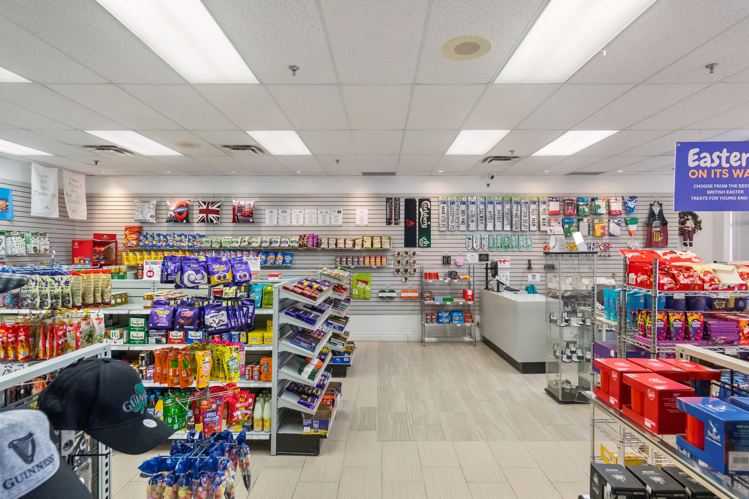 Convenience store interior with shelves of snacks and beverages