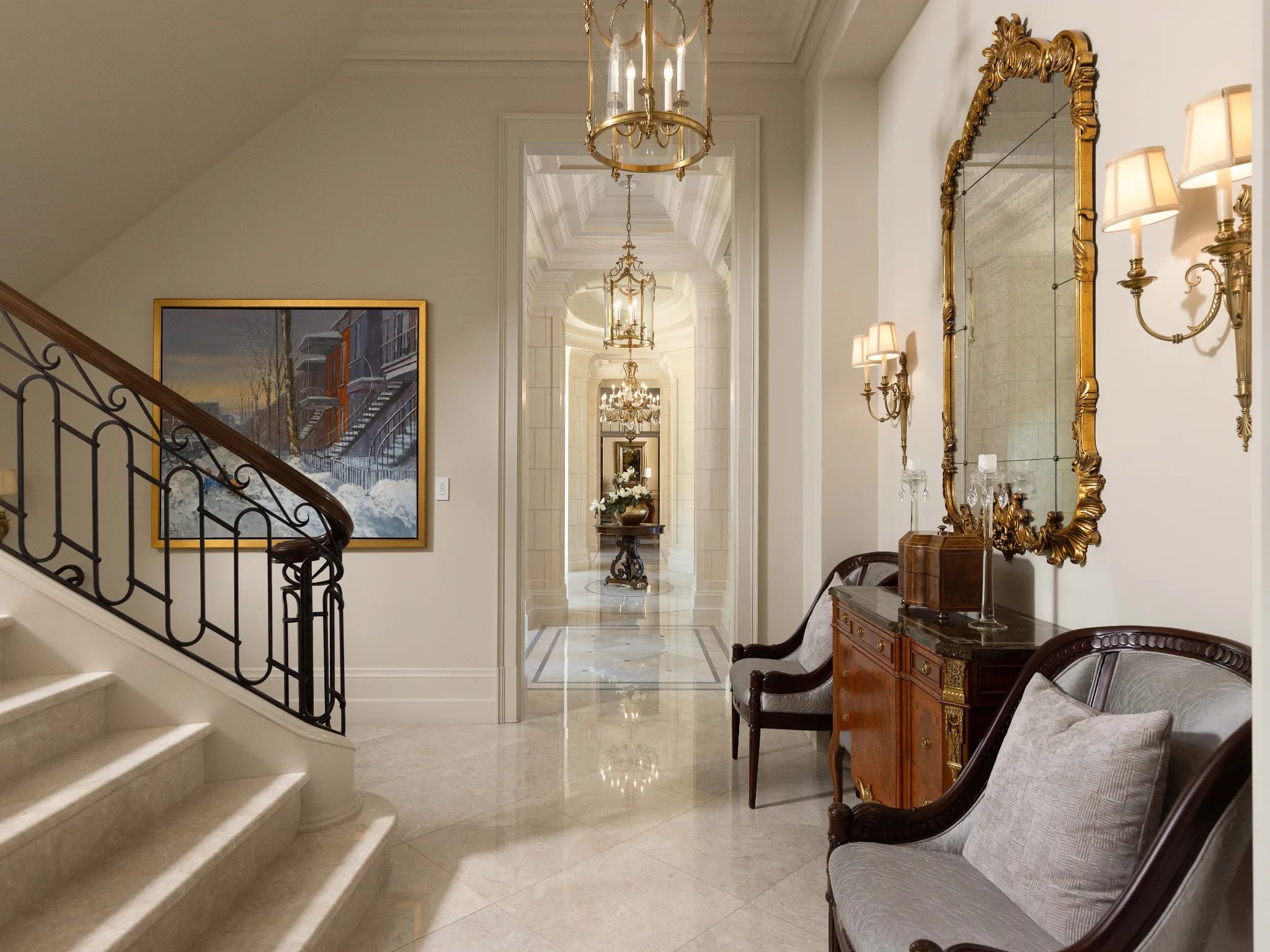 stairway with stone floors and staircase. gold mirror and lightfixtures