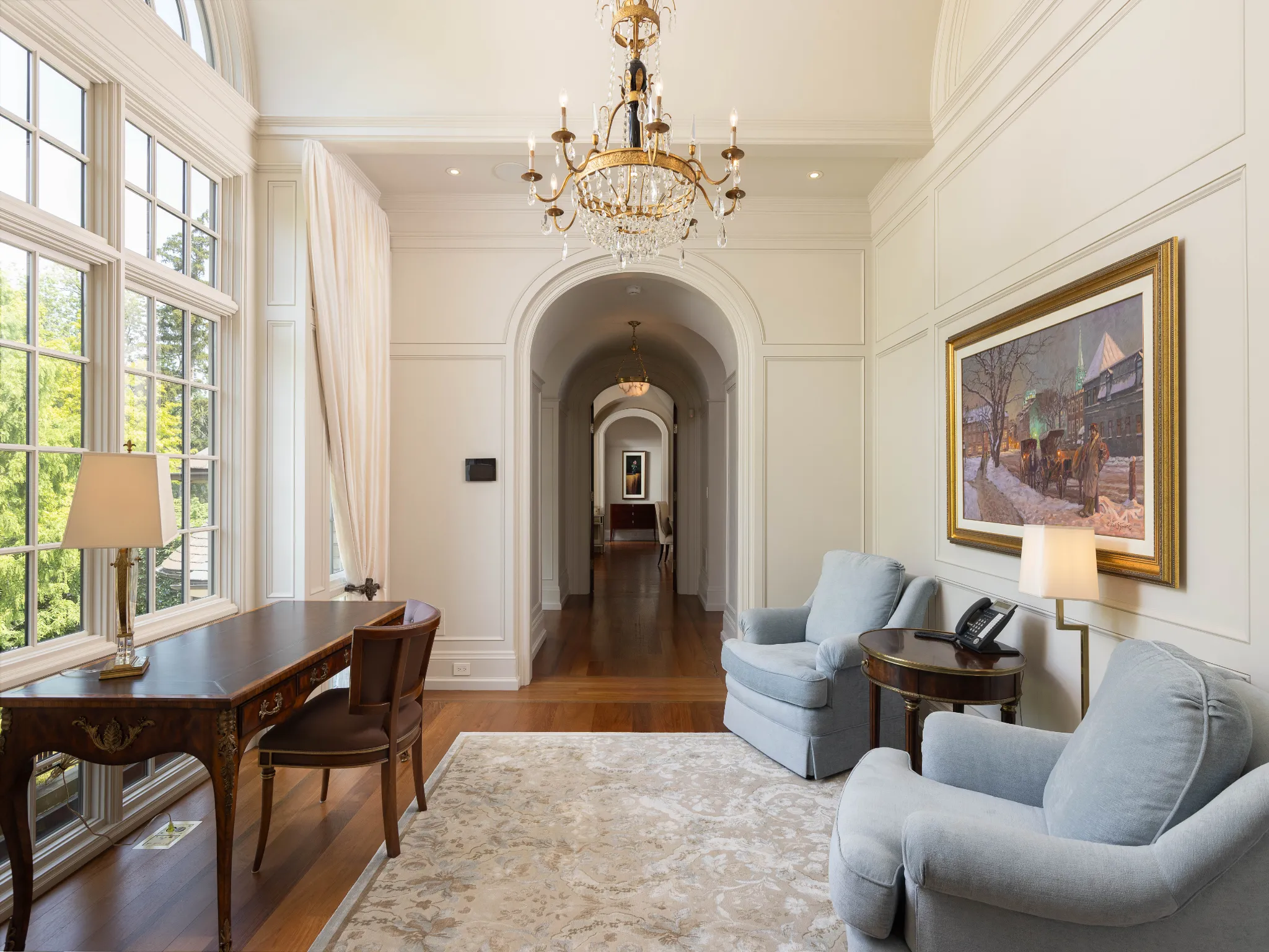 upstairs hallway with seating area, two large comfortable chairs