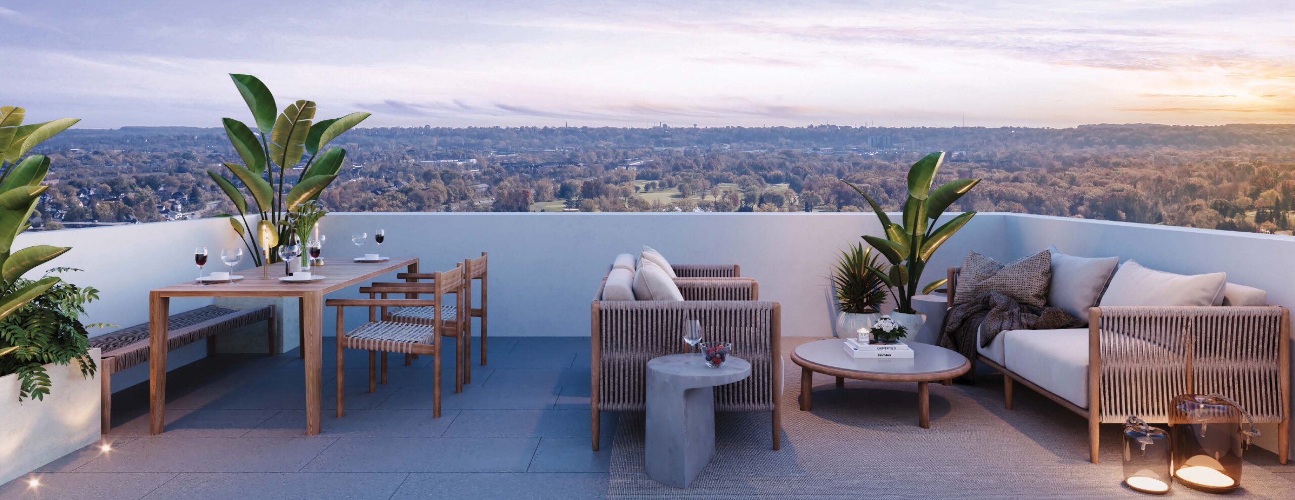 Stylish terrace with seating, dining area, and city view at sunset