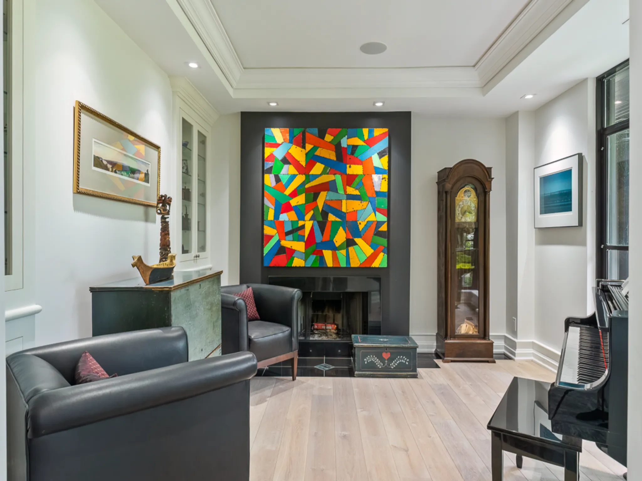 Modern living room featuring colorful abstract artwork and elegant furnishings