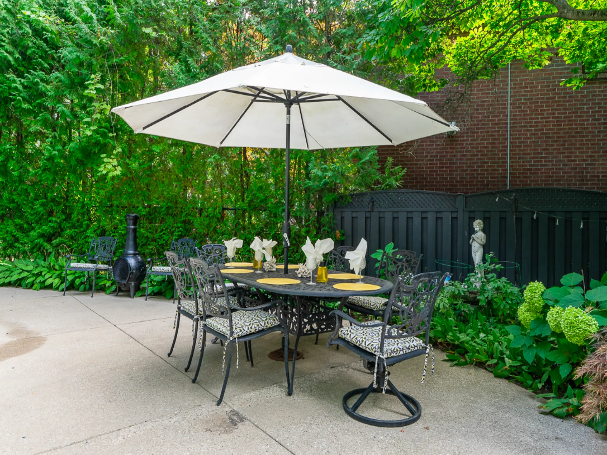 outdoor patio with table and white umrella