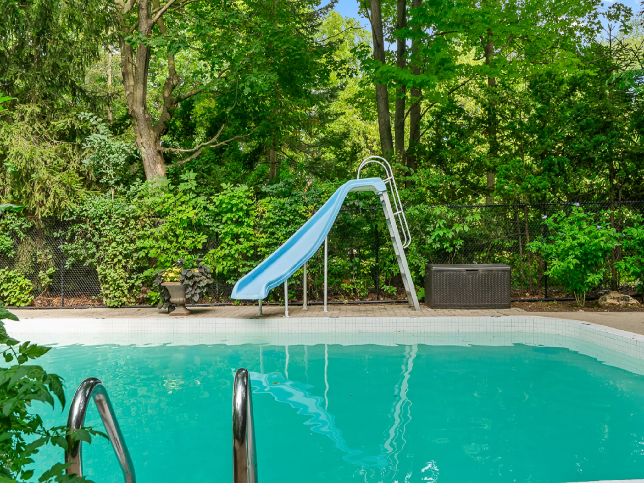 beautiful blue pool with big slide