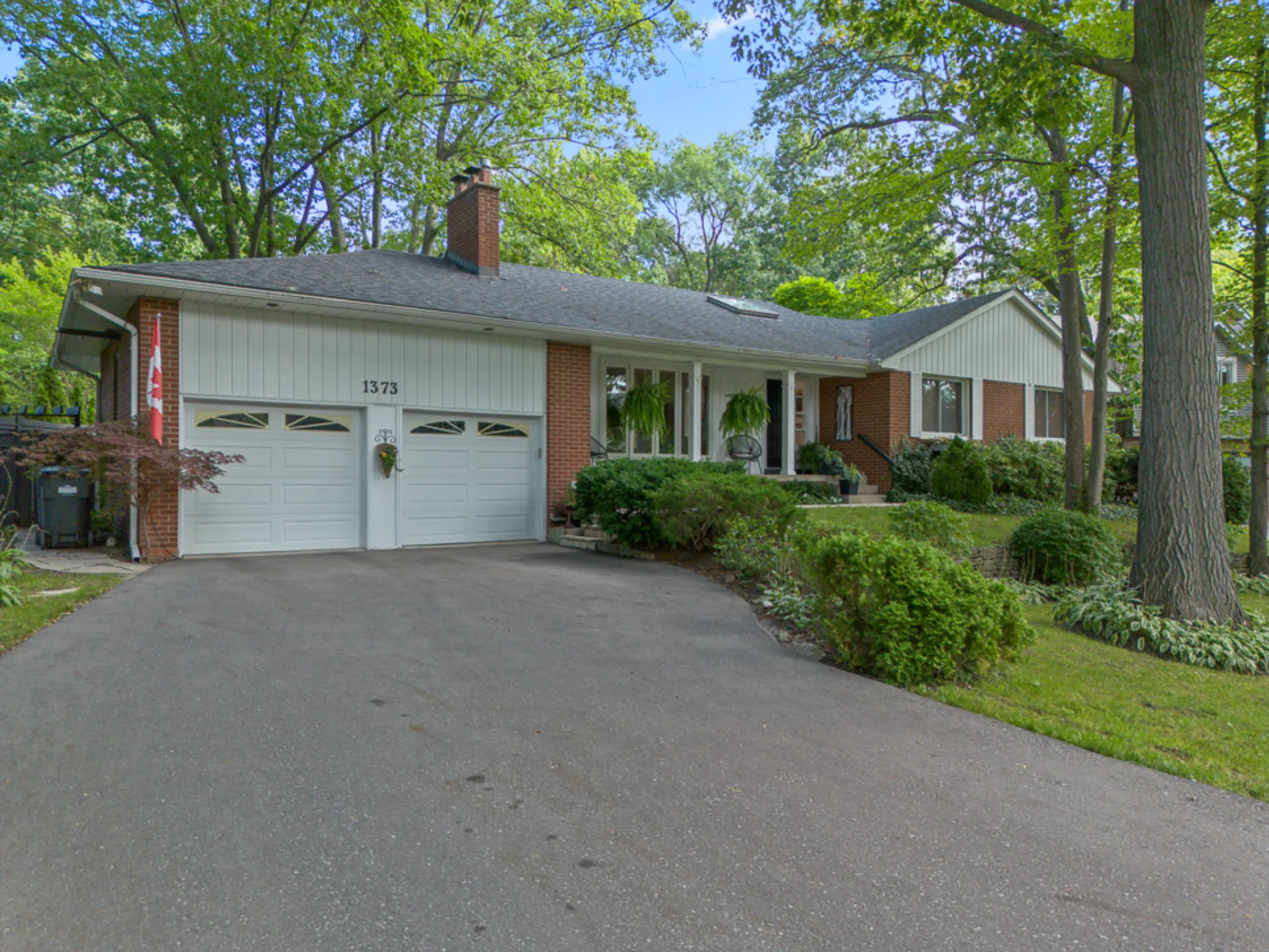 exterior front with large driveway and double car garage