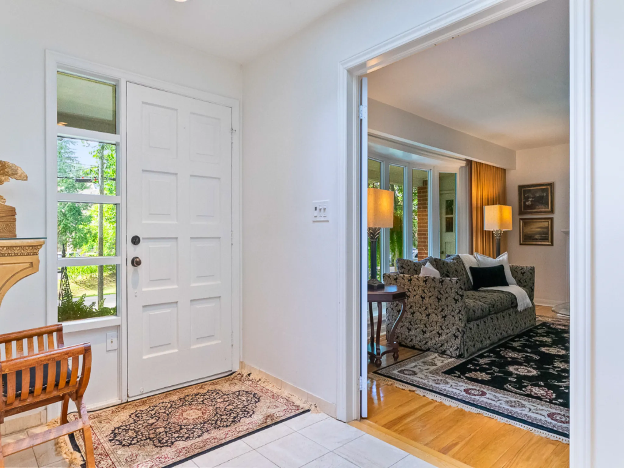front foyer with windows and hardwood floors