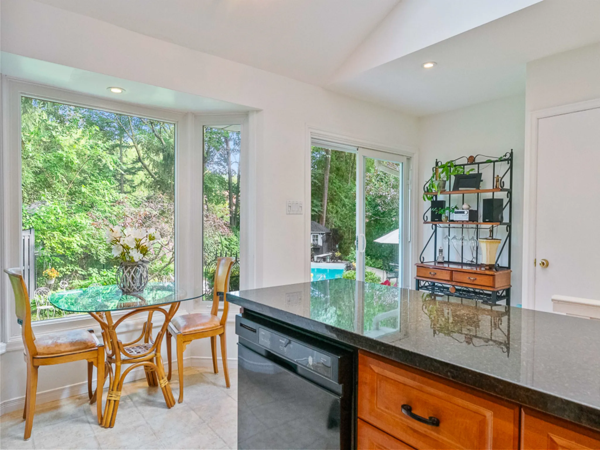 kitchen and breakfast area overlooking backyard