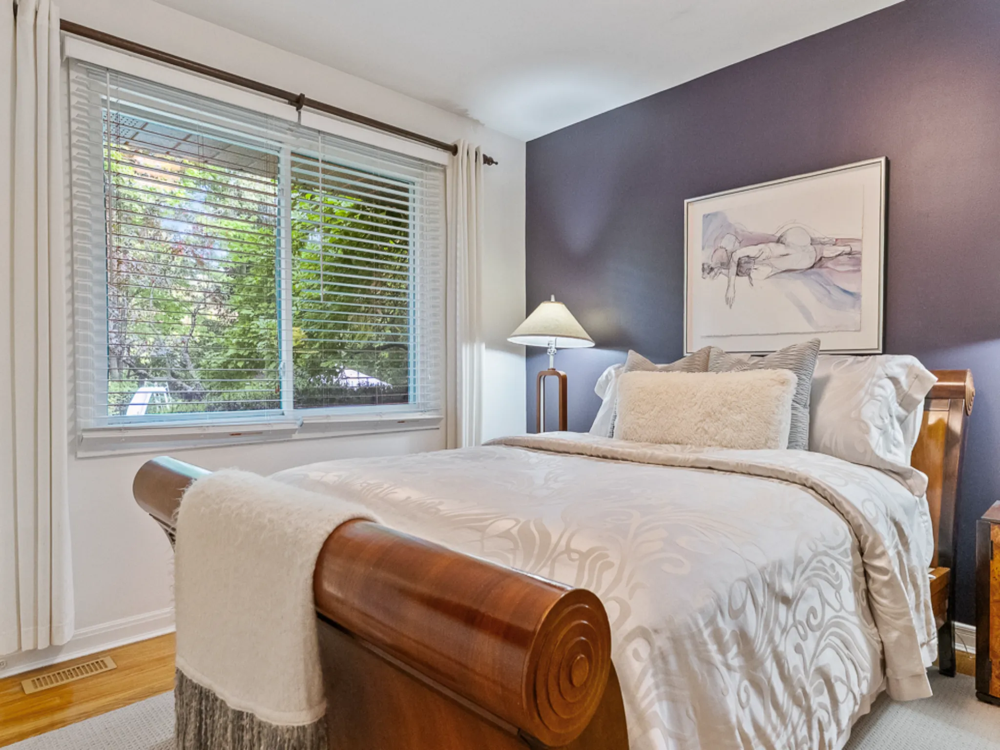 principle bedroom with hardwood floors