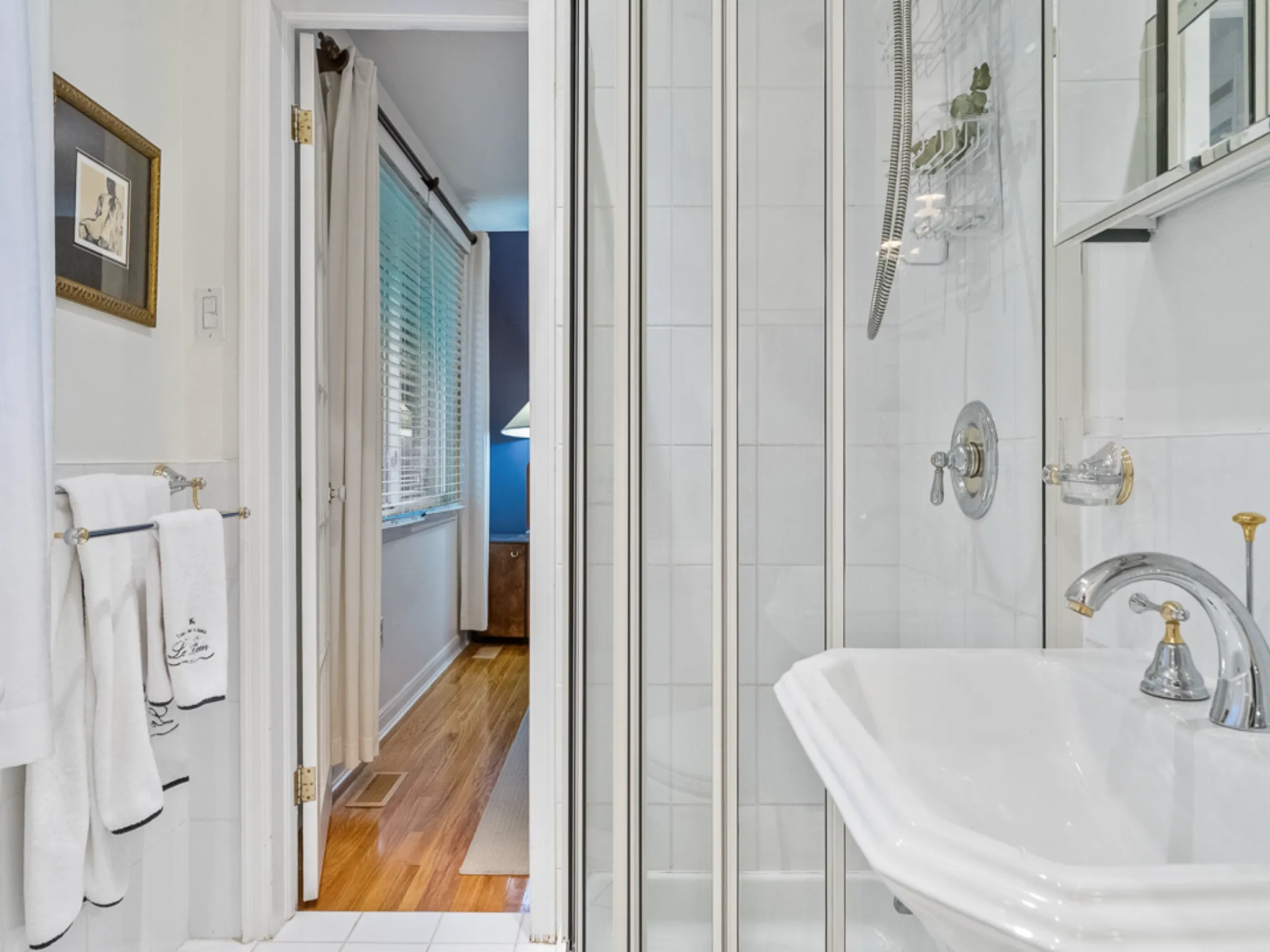 bathroom with white tiled shower