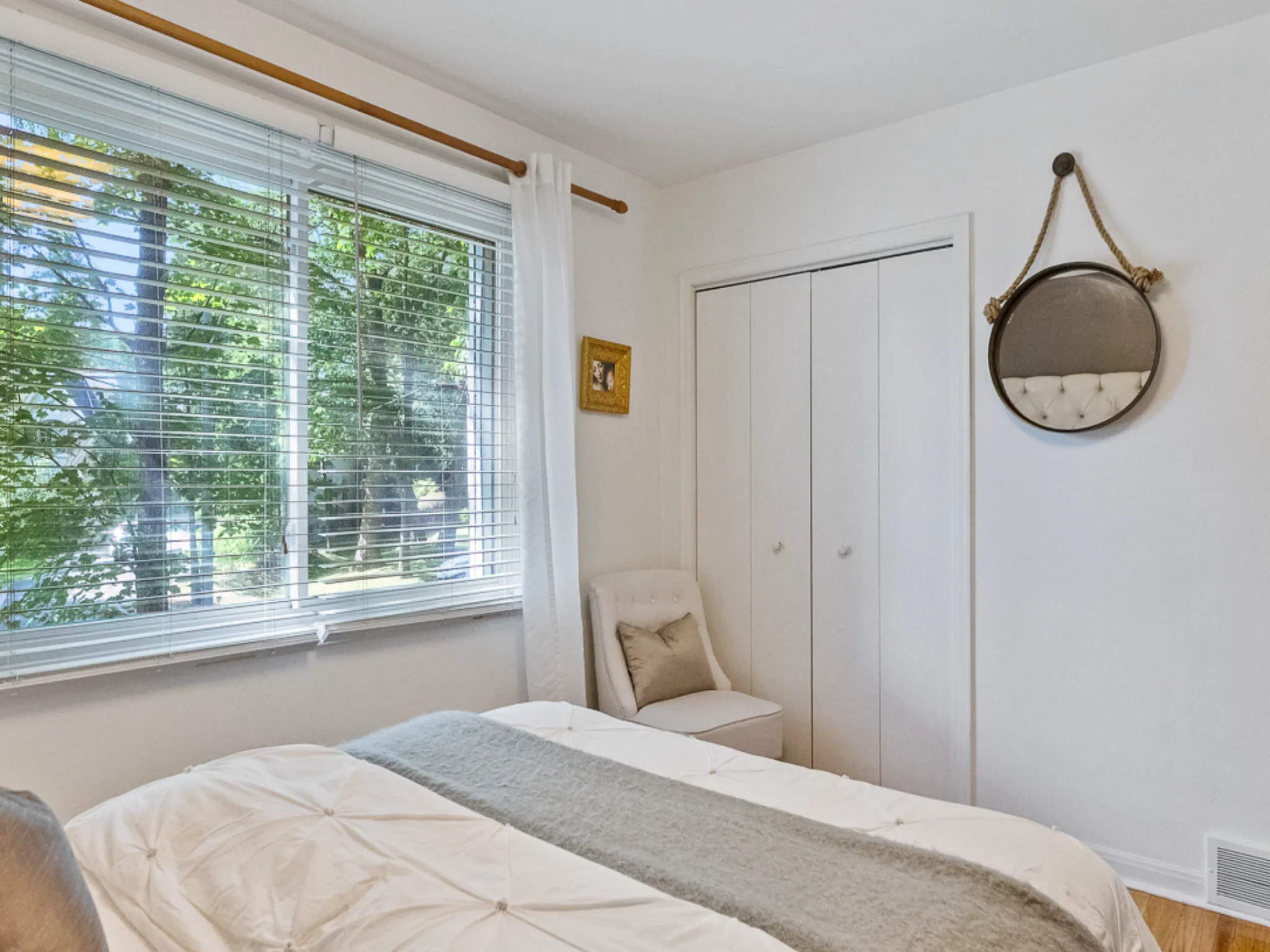bedroom with closet and views to yard