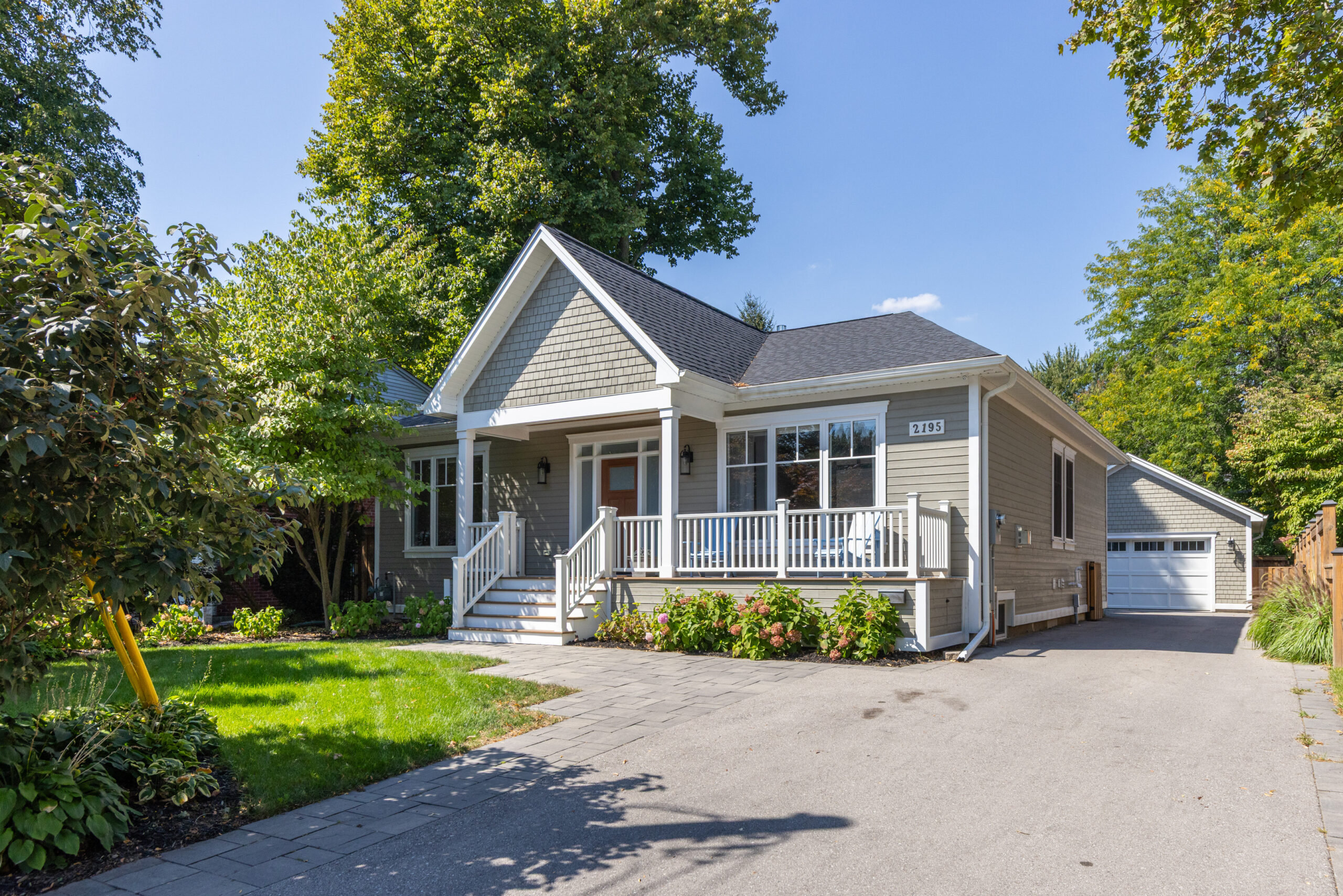 Single-story house with a front porch and landscaped yard