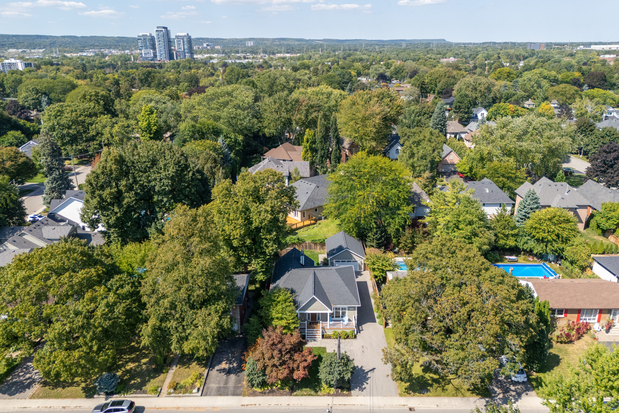 Aerial view of residential neighborhood with trees and houses