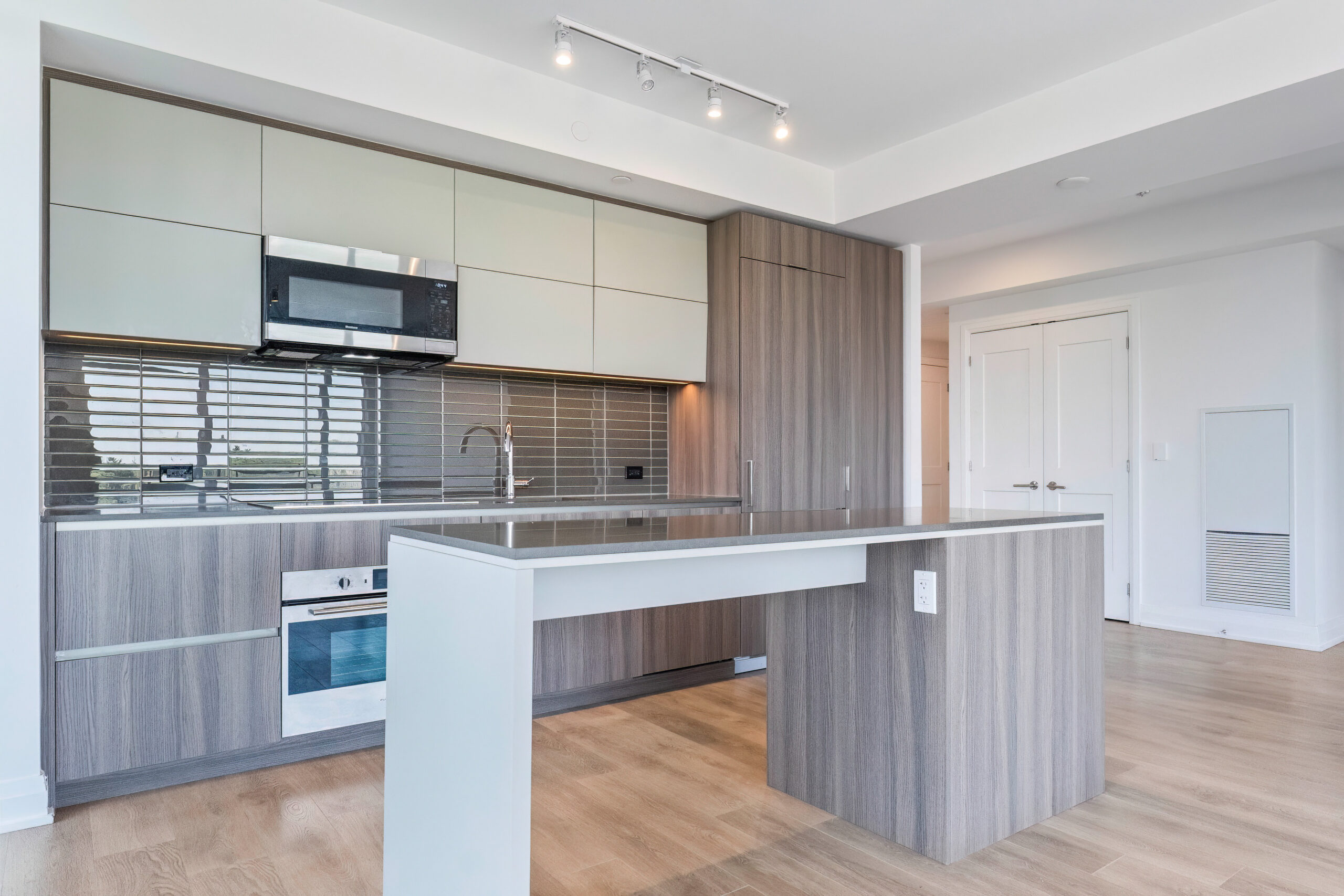 Modern kitchen with wooden cabinetry and stainless steel appliances