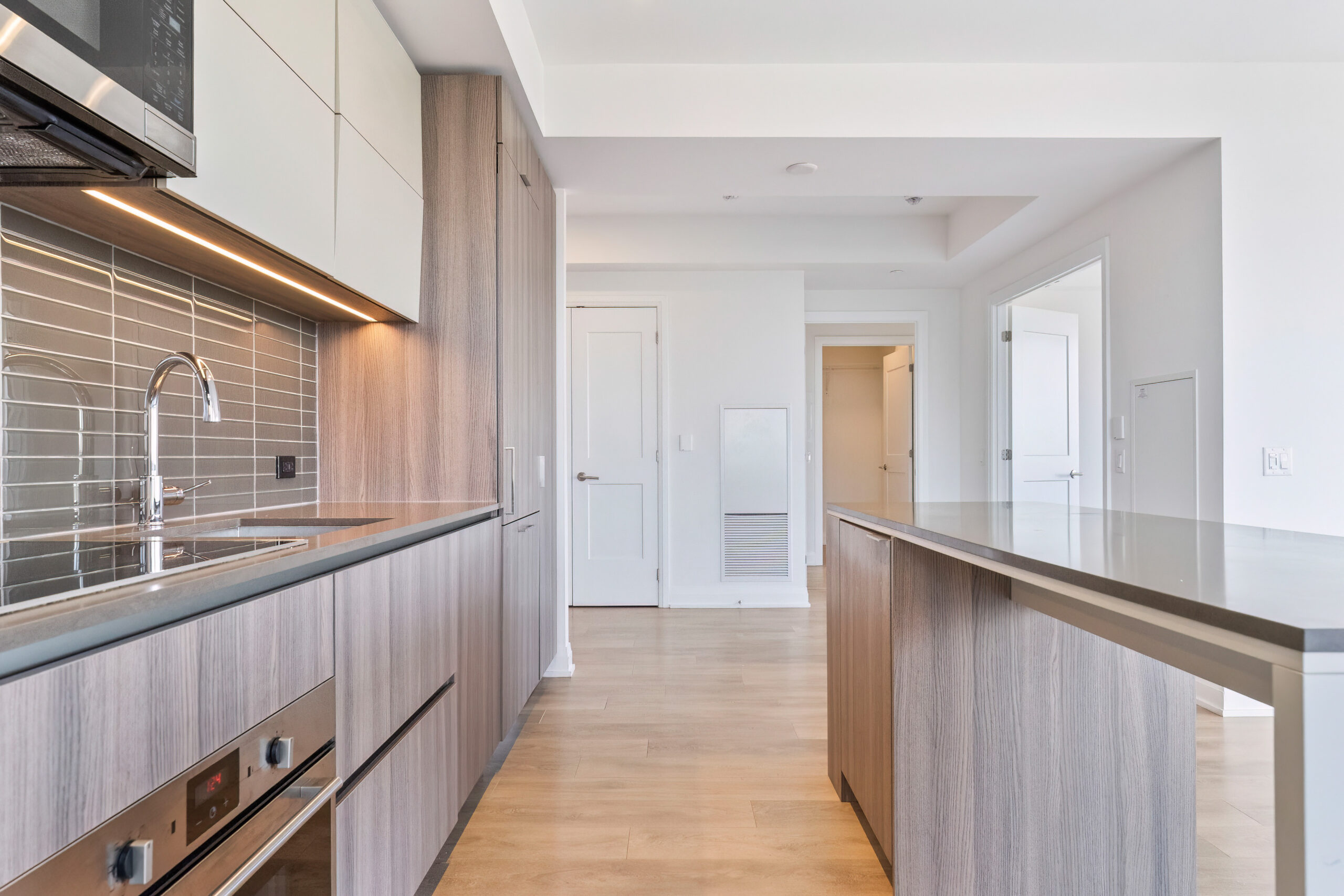 Modern kitchen with wooden cabinetry and stainless steel appliances