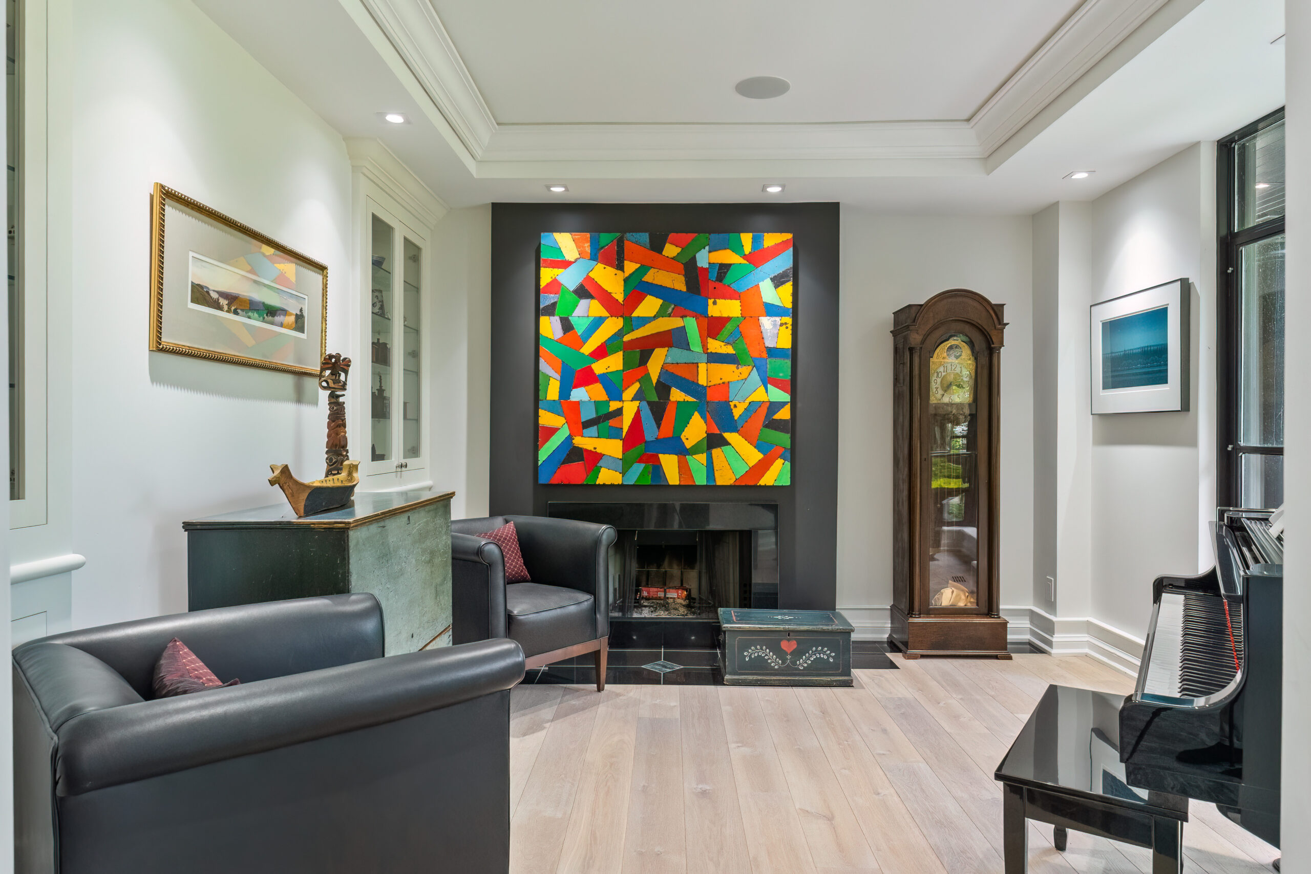 Modern living room featuring colorful abstract artwork and elegant furnishings