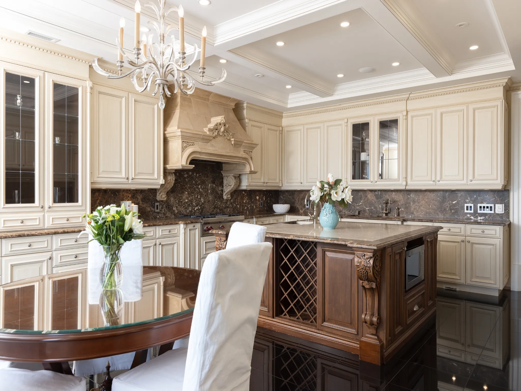kitchen with beige cabinetry and dark wood island