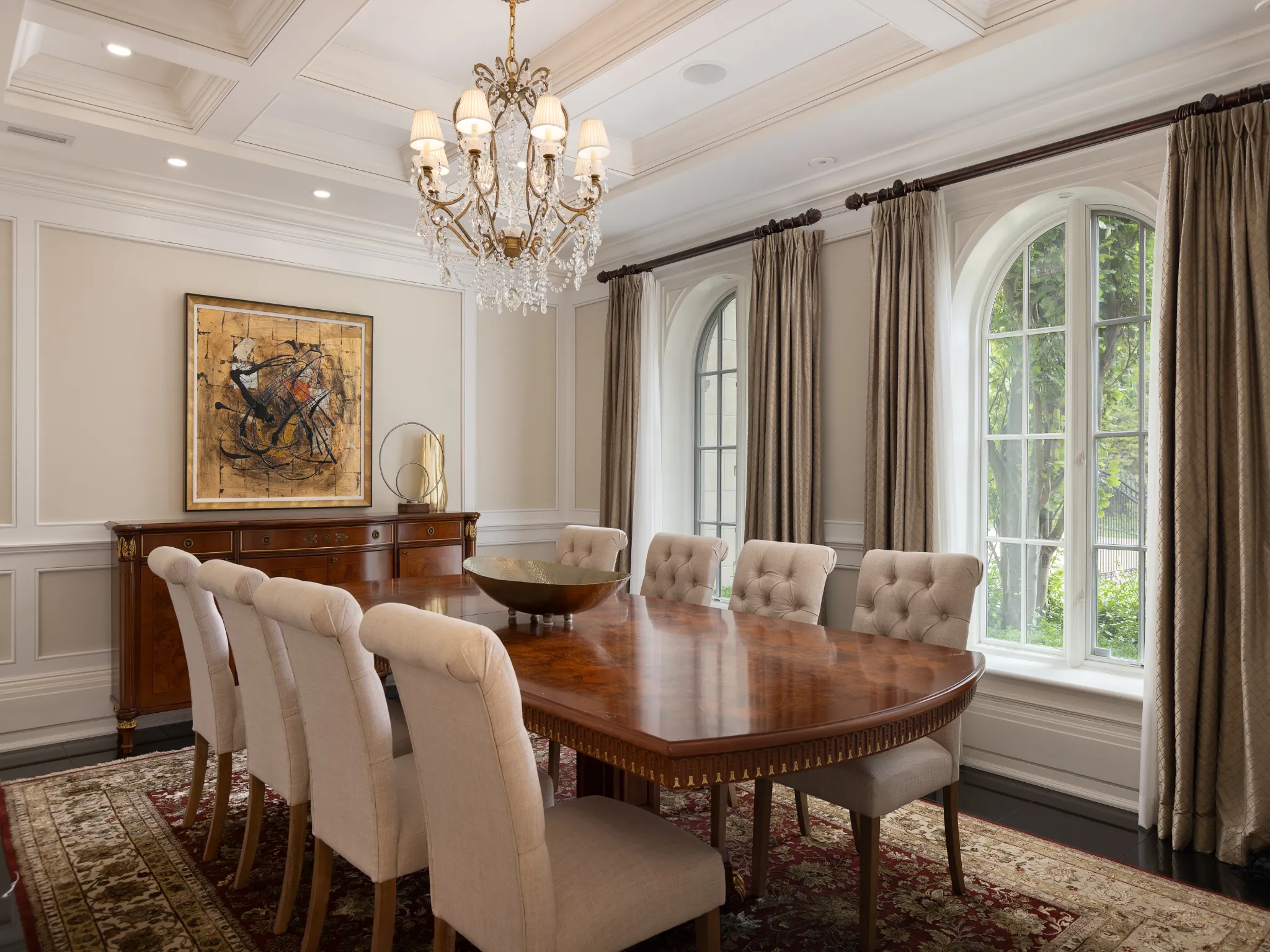 formal dining room with large windows and chandelier