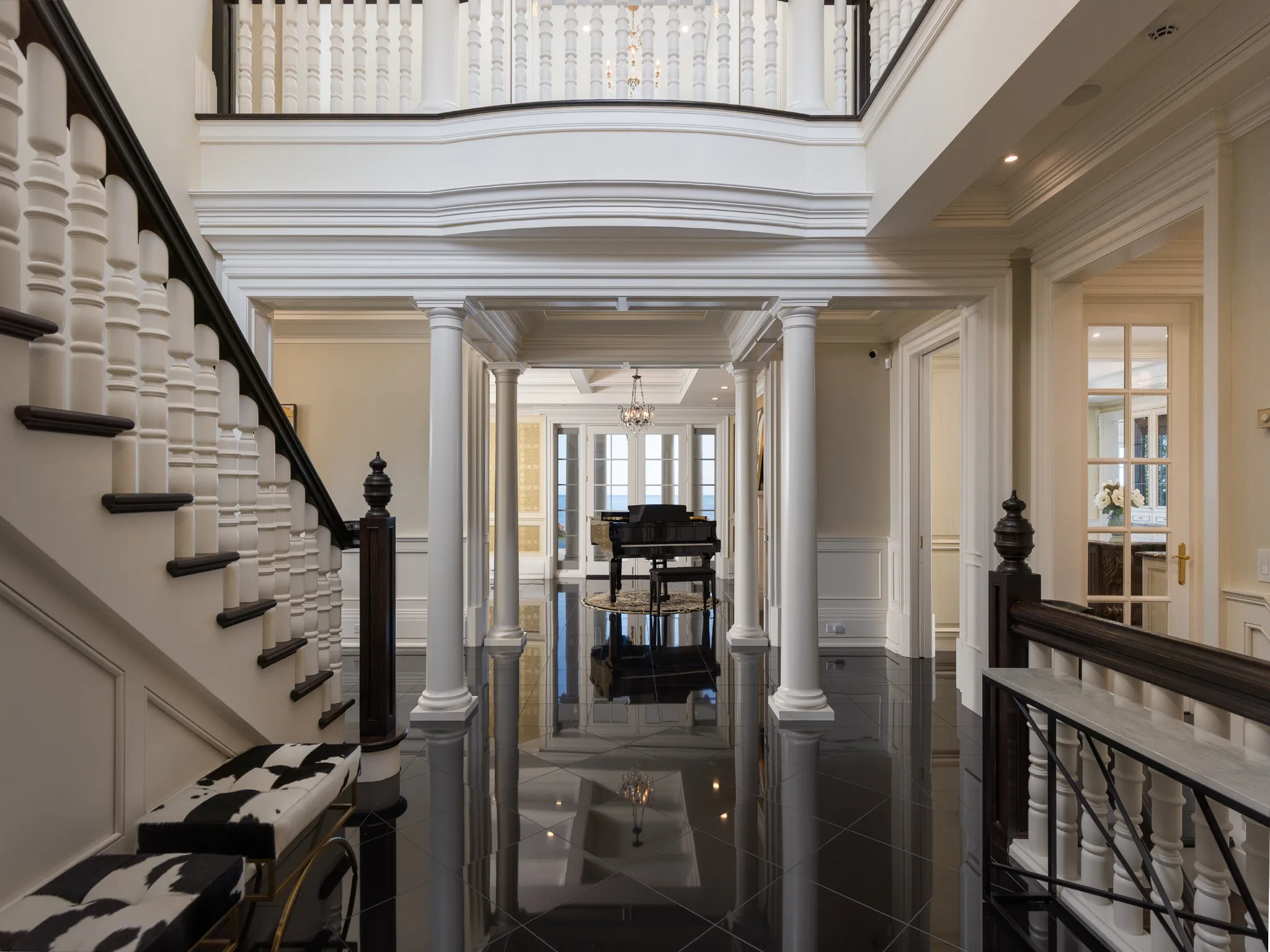 foyer with dark stone flooring and piano
