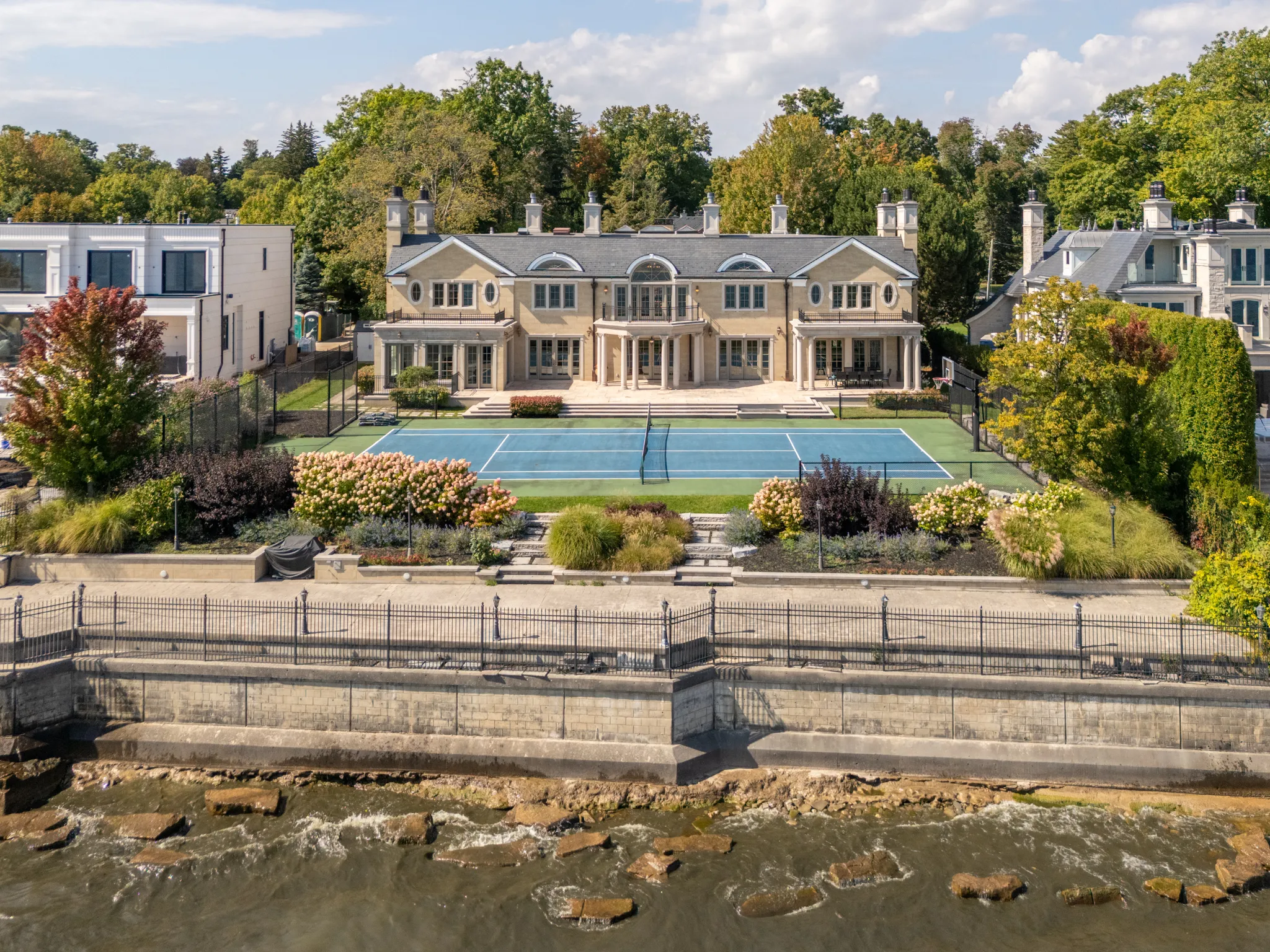 exterior of the home showing seawall and lake