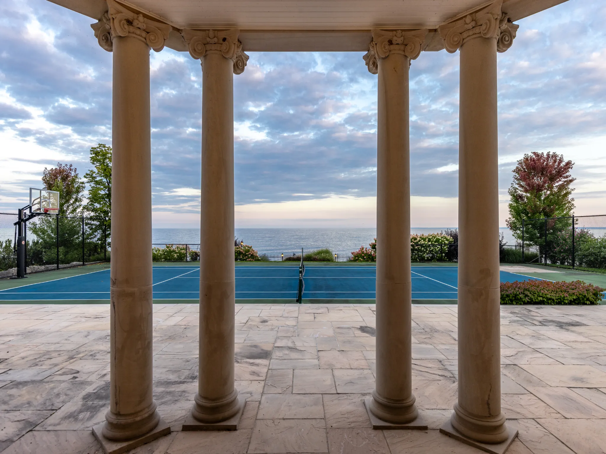 pillars on the back of the home with lake in background